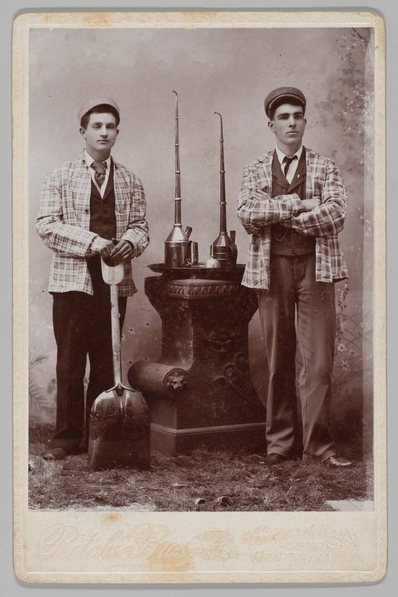 [Railroad Workers with Oil Cans and Coal Shovel], collodion print by Ritchie Bros.