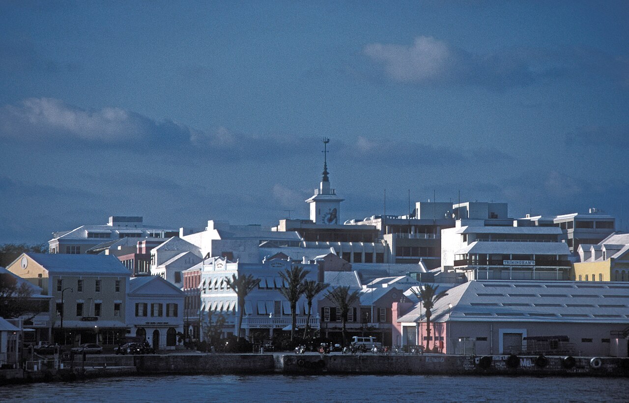 Pastel buildings along Front Street and the waterfront of Hamilton, Bermuda, seen from a ferry on Great Sound
