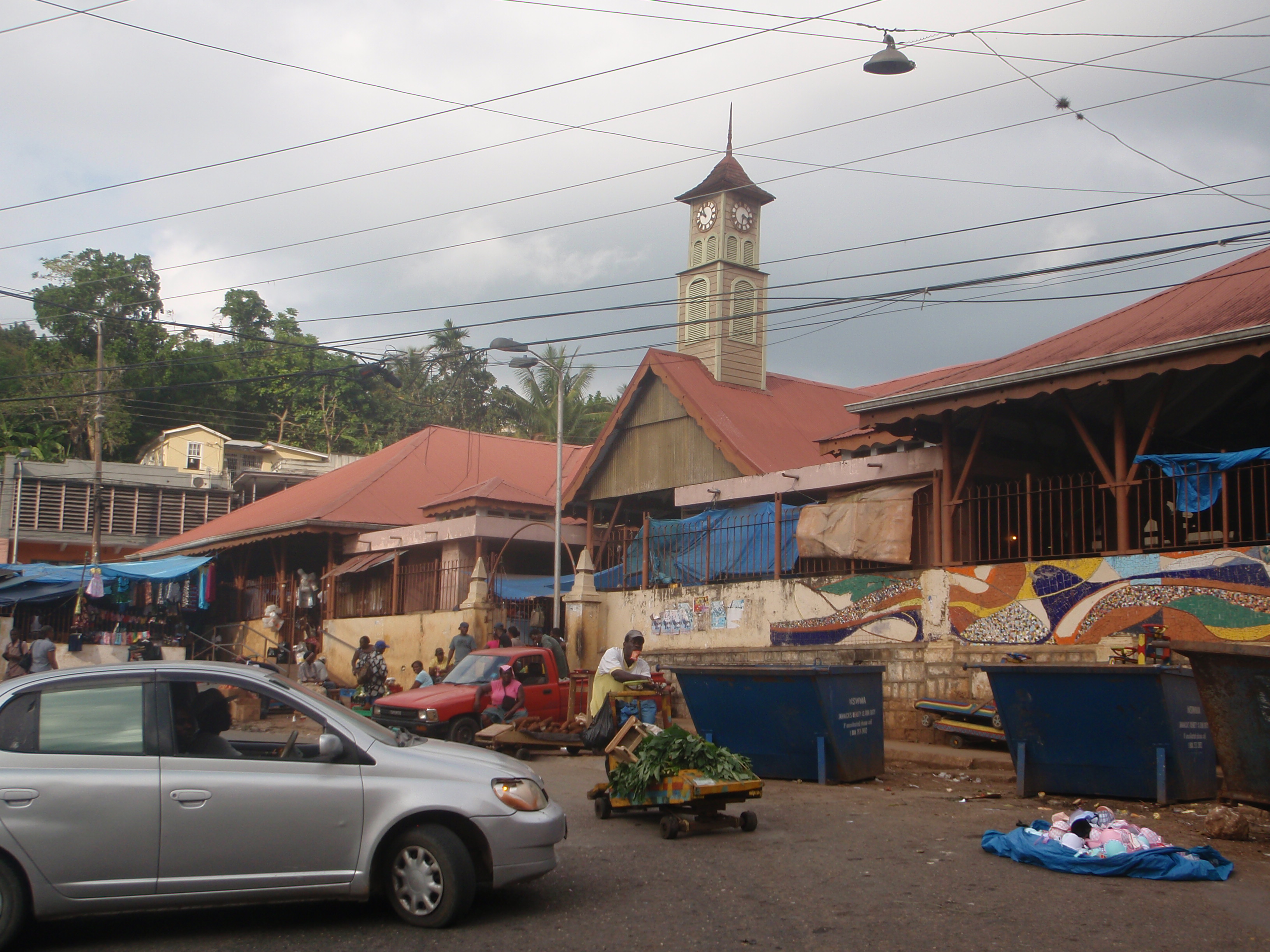 Vendors and vehicles around the market clock tower in Brown’s Town, Jamaica