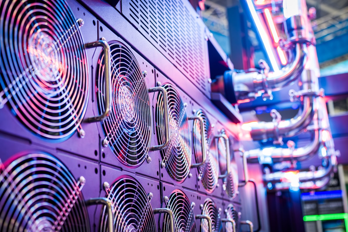 Close-up of illuminated server racks in a data center, representing the 450 megawatts of AI infrastructure Trinidad and Tobago agreed to in July 2026