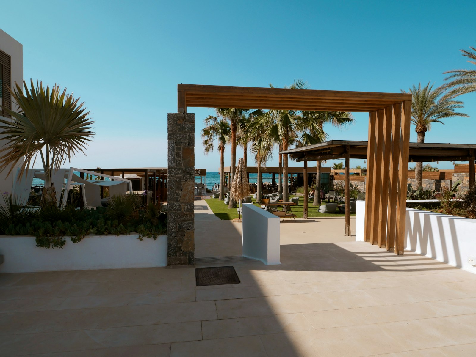 An empty resort entrance and courtyard with palm trees and no visible staff or guests, representing the independent Caribbean properties CHTA's workforce guide is aimed at supporting