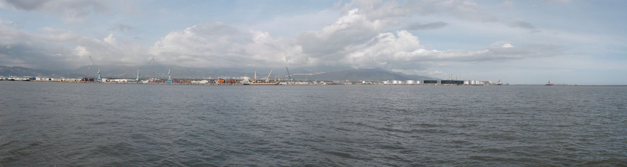 Cranes and freight facilities across Kingston Harbour in Jamaica, photographed in 2004