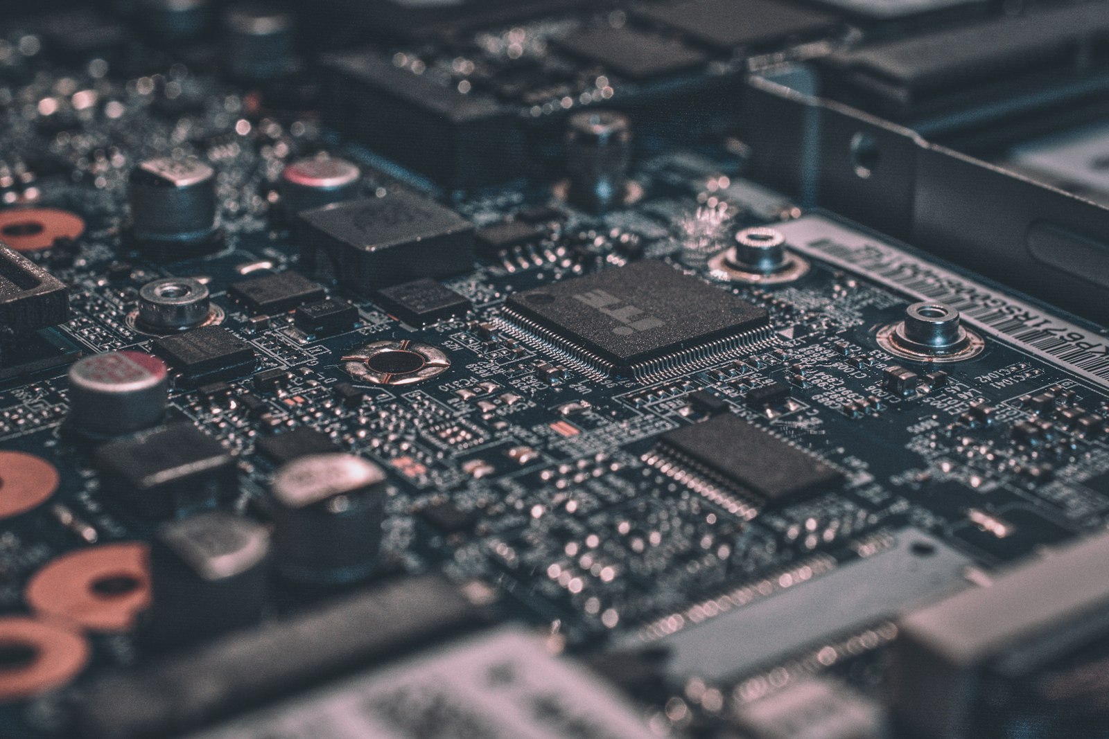 Macro close-up of a densely populated circuit board, representing the technical infrastructure layer beneath any AI deployment